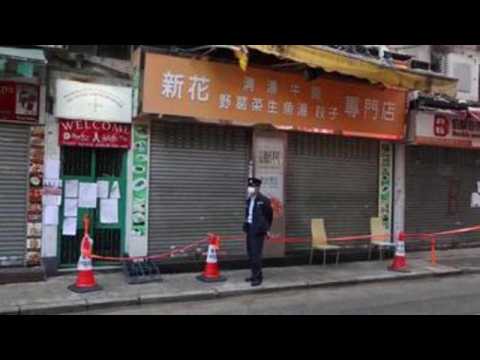 Hong Kong imposes curfew to curb virus spread