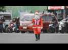 Traffic enforcer dressed as Santa Claus in Philippines