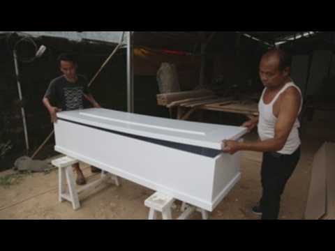 Coffin-makers in Indonesia racing against time to meet demands during pandemic