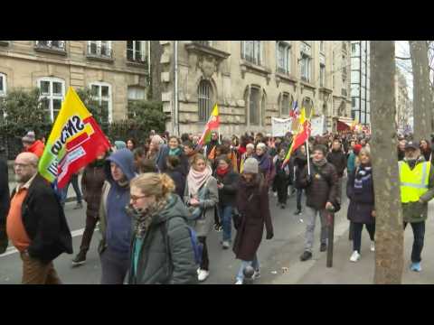 Demonstrators march in Paris against pensions reform