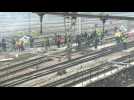 Striking railway workers protest on Paris train tracks