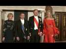 French President Macron and his wife pose for photos with Dutch King Willem-Alexander, Queen Maxima