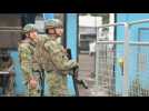 Security guard outside Ecuador prison where six inmates found dead