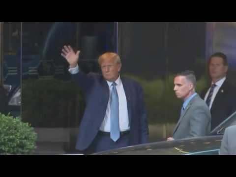 Trump waves after testifying under oath in New York fraud lawsuit