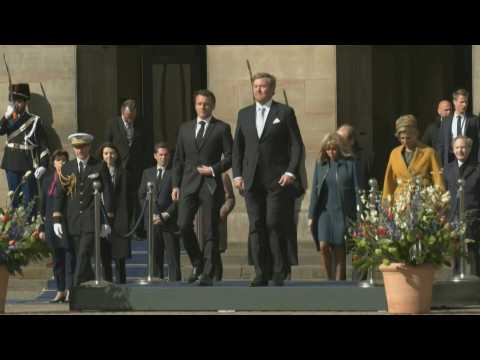 French President Macron greeted by Dutch king in Amsterdam