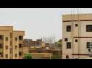 Smoke rises above buildings as regular army battles paramilitaries in Sudan capital