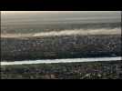 Aerial view of smoke billowing from Khartoum skyline - Label : AFPTV - First images - Category : News