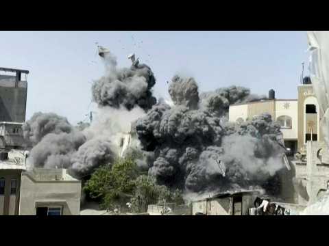 Dust fills the air as Israeli strike hits building in Gaza City