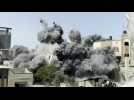 Dust fills the air as Israeli strike hits building in Gaza City