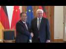 Chinese Premier Li Qiang signs guestbook, shakes hands with German President Steinmeier