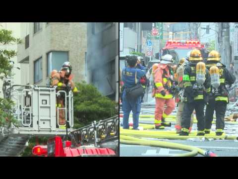 Fire fighters and rescuers at blast site in Tokyo