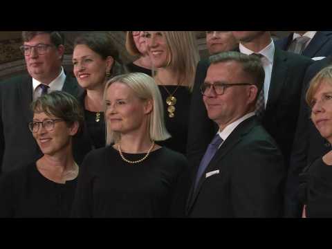 Finland's new government poses for a group photo as it takes office