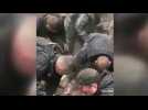 Ukrainian rescuers pull a woman out of the rubble after a strike in Kupiansk