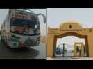 Buses carrying Egyptian and Sudanese evacuees arrive at Egypt-Sudan border