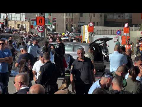 Police gather after car hits five in Jerusalem, driver shot