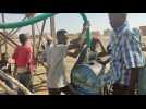 Sudanese fill water in barrels amid shortage caused by fighting