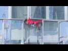 'French Spiderman' Alain Robert climbs skyscraper to protest pension reform