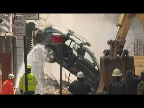 Cars cleared from site of parking garage collapse in New York City