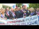 French conservatives march in support of mayor after attack