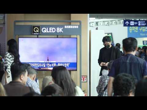 People in Seoul watch news as NKorea fires long-range ballistic missile