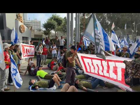 Israelis protest outside the defence ministry against judicial overhaul