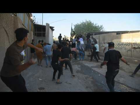 Protesters clash with security forces near the Swedish embassy in Baghdad