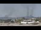 Smoke rises above evacuated Greek town of Kiotari on Rhodes as fires rage