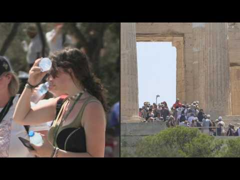 People in Athens queue for Acropolis before it closes due to heatwave