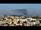 Libya: Smoke billows following overnight clashes between militants in Tripoli