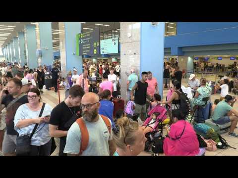 Travellers at Rhodes airport waiting to leave Greek island