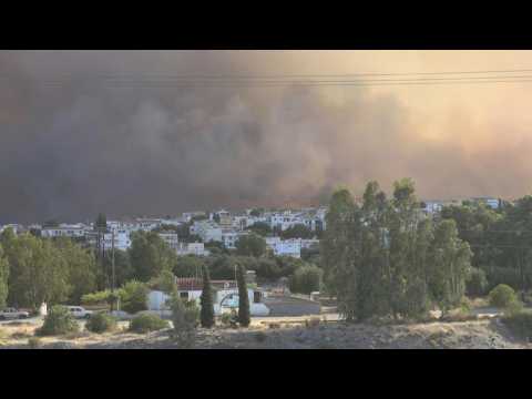 Wildfire approaching village on Rhodes island in Greece