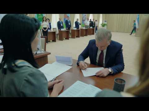 Uzbek President Mirziyoyev votes in snap election