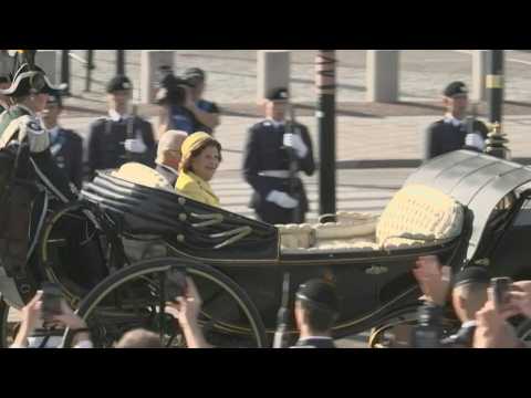 Sweden's King Carl XVI Gustaf and Queen Silvia parade in golden jubilee celebrations