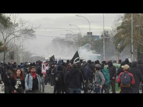 Chile police use water cannon to disperse protesters day before coup anniversary