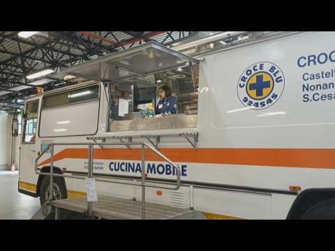 Mobile kitchen offers Italy's flood volunteers free meals