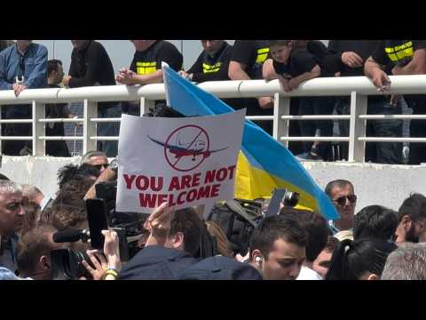 Protesters greet first passenger plane from Russia to land in Georgia in years