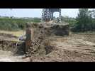 Italy: bulldozers work to repair bridge damaged in the floods