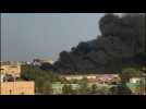 Gunfire sounds as heavy smoke billows over Sudan capital
