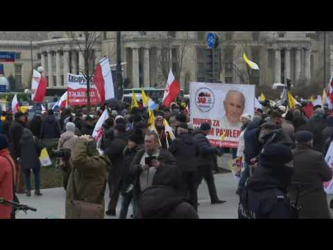 Thousands march in Polish capital Warsaw to defend memory of late Pope John Paul II