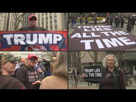 Protesters wave flags, hold up signs outside Manhattan court ahead of Trump arraignment
