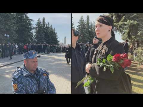 People gather for funeral of top Russian military blogger killed in cafe blast