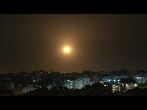 Rockets intercepted by Israel's Iron Dome over Gaza City skyline