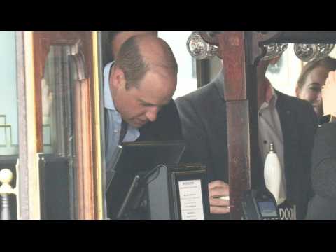 Prince William pulls a pint of beer at the Dog &amp; Duck pub in Soho