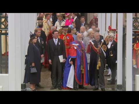 Prince Harry and Prince Andrew wait outside Westminster Abbey after Charles' Coronation