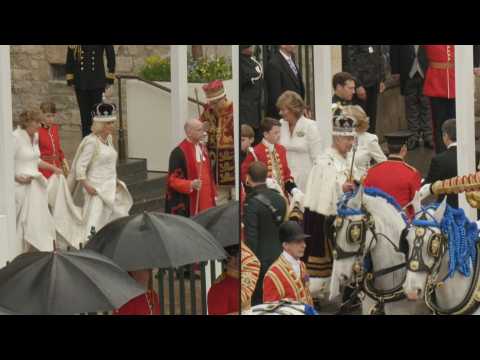 Charles III and Queen Camilla leave Westminster Abbey after the coronation