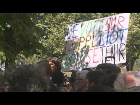 Dozens of left-wing activists gather outside French parliament