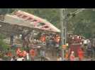 Workers continue clearing site of India's train crash