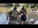 Citizens evacuated from flooded streets of Kherson after dam collapse