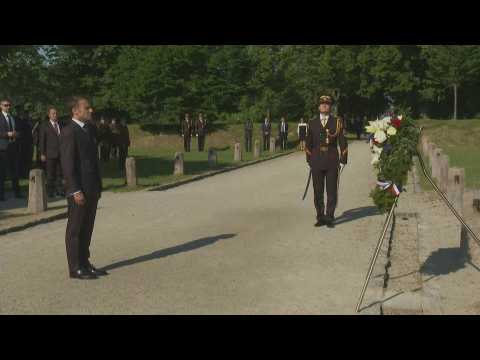 Macron takes part in a ceremony in Bratislava before leaving for Moldova