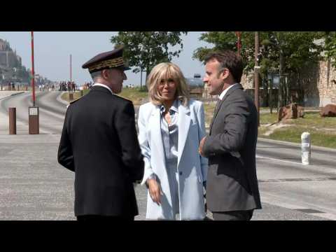 Emmanuel and Brigitte Macron arrive at the Couesnon dam near Mont-Saint-Michel